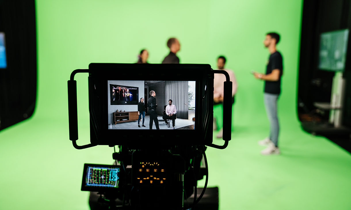 Video camera screen in front of student group.