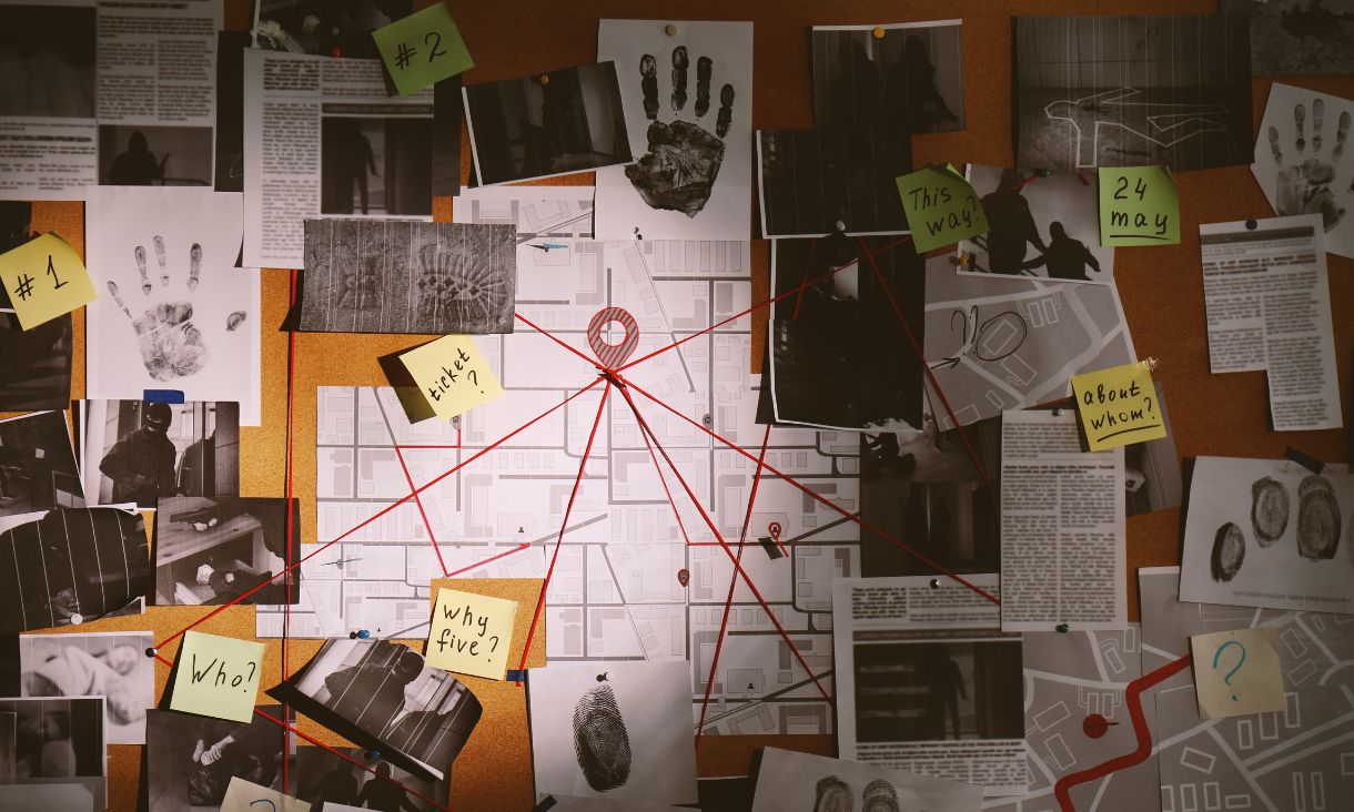 A pin board tracking and connecting all the evidence of a crime.