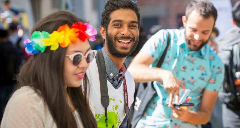A student smiles at the camera during an orientation event at the City Campus.