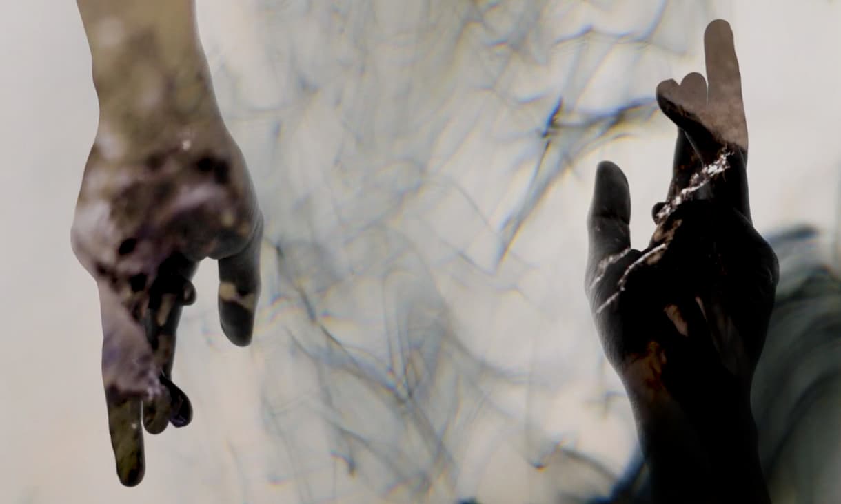 Abstract black and white image of two hands.