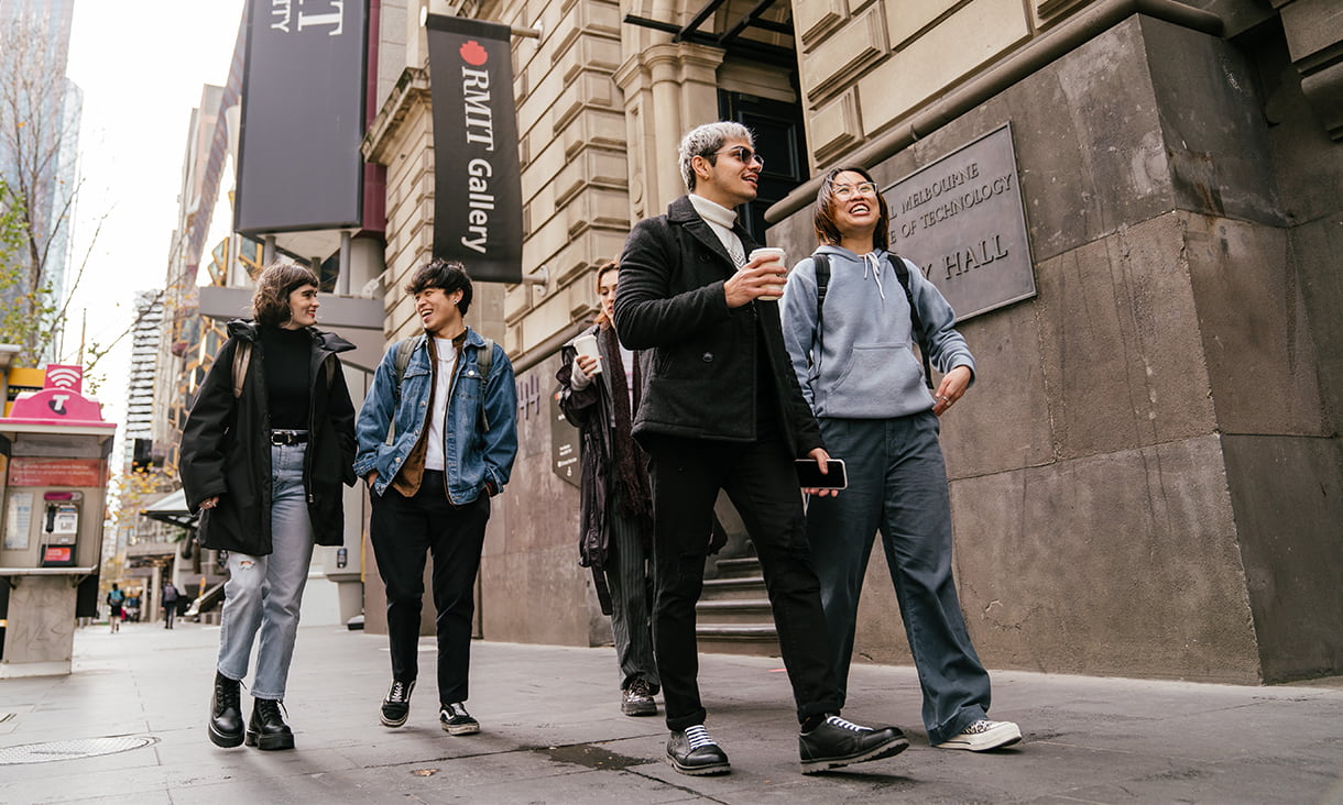 RMIT international students walking and talking on Swanston St