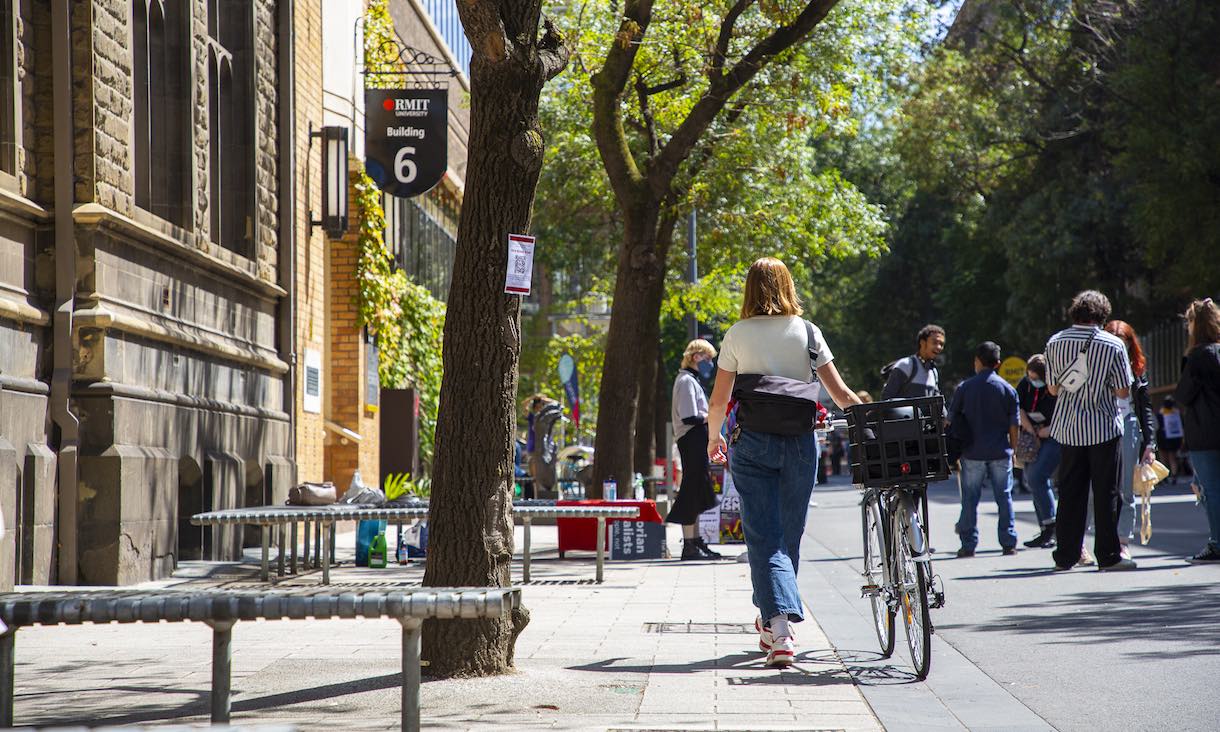 Student with bike on Bowen Street.